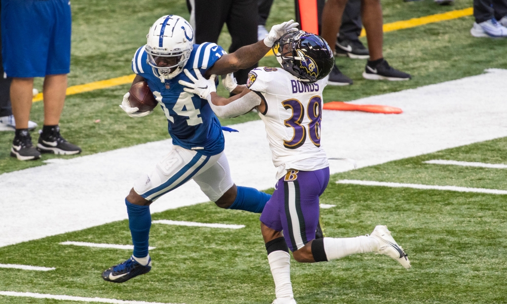 Terrell Bonds tries to tackle Zach Pascal in a Colts vs Baltimore Ravens game.